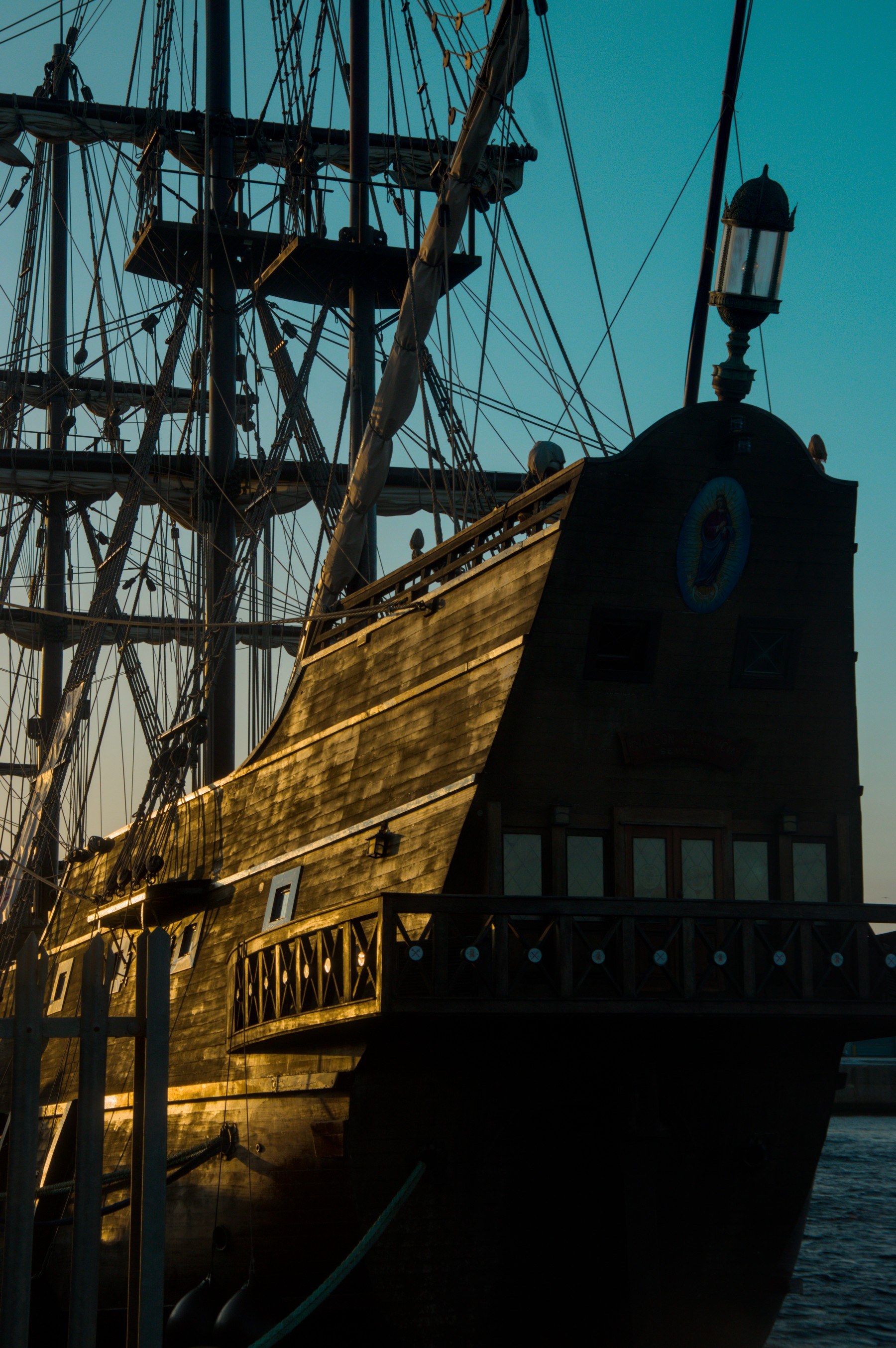 Close view of Galeón Andalucía’s sunlit wooden hull, rear lantern and dense rigging at the Port of Ayr.